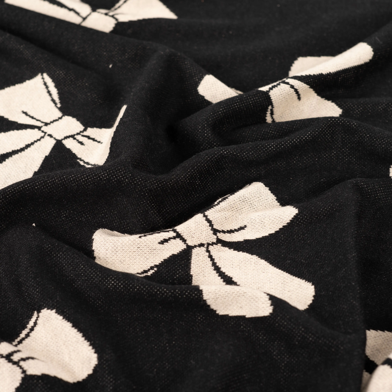 Tissu Maille Tricot Noire à Noeud Blanc